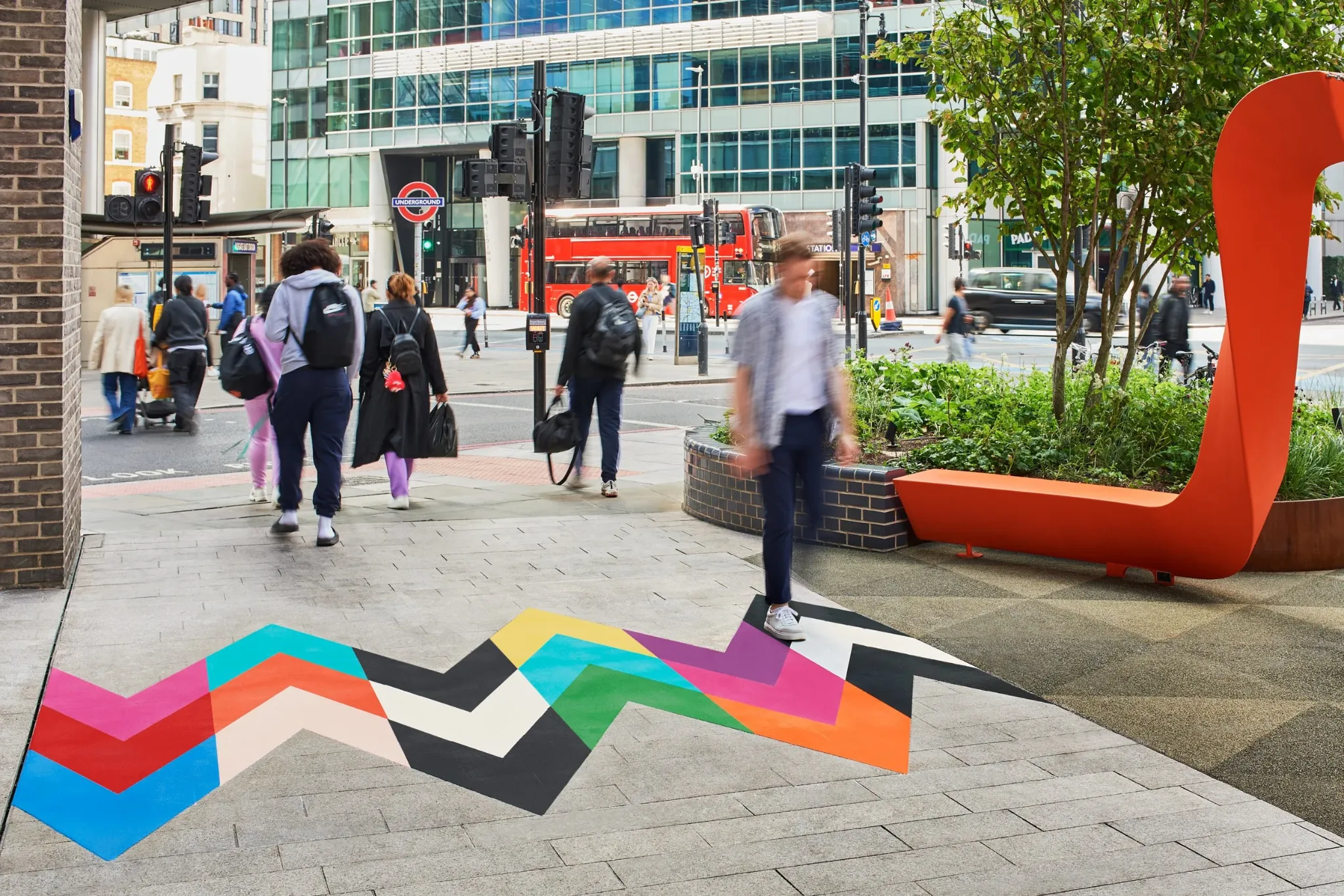 Intersection artwork connecting a public garden with a busy London street