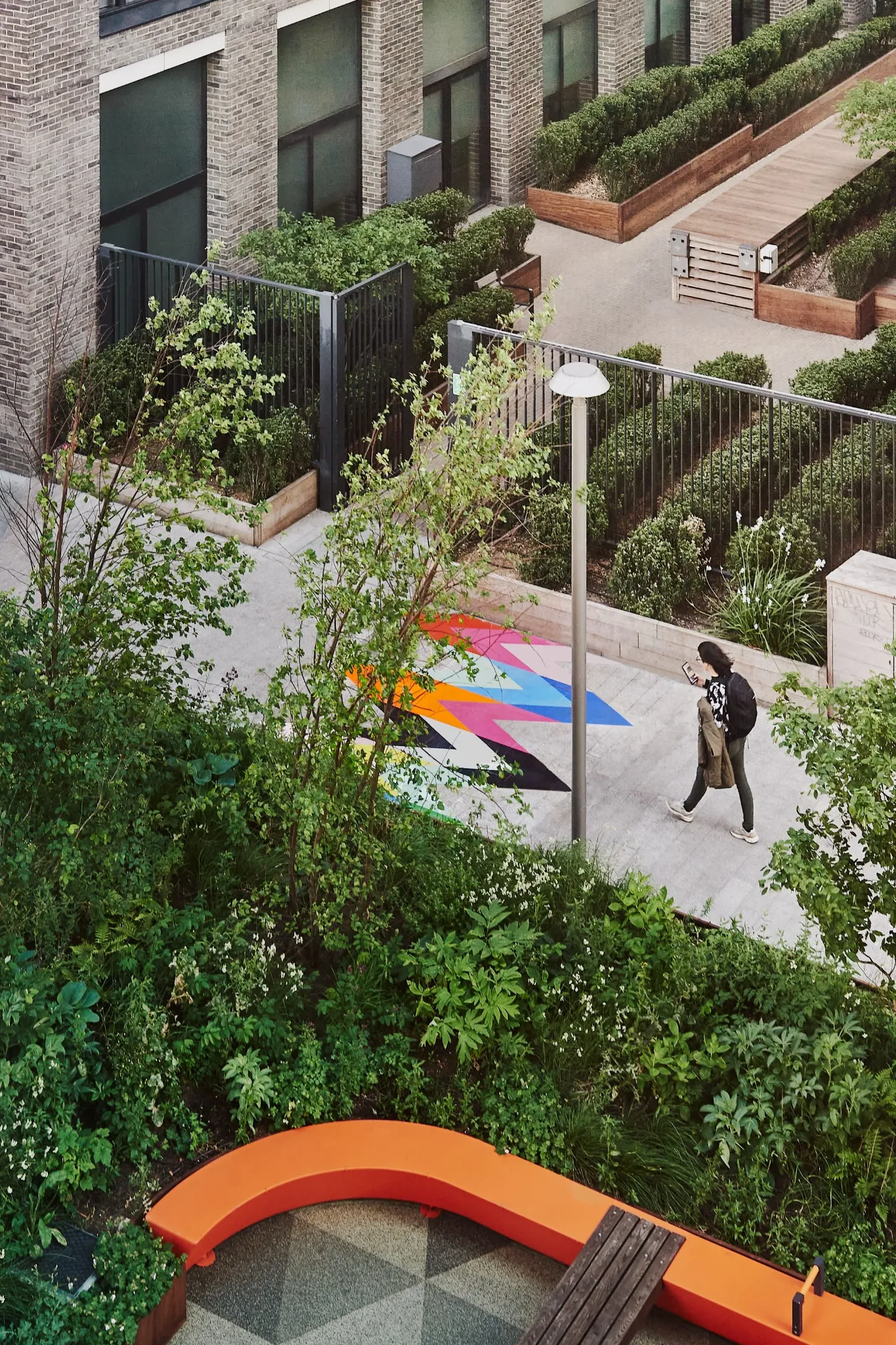 Intersection artwork seen from above within the landscaped public garden