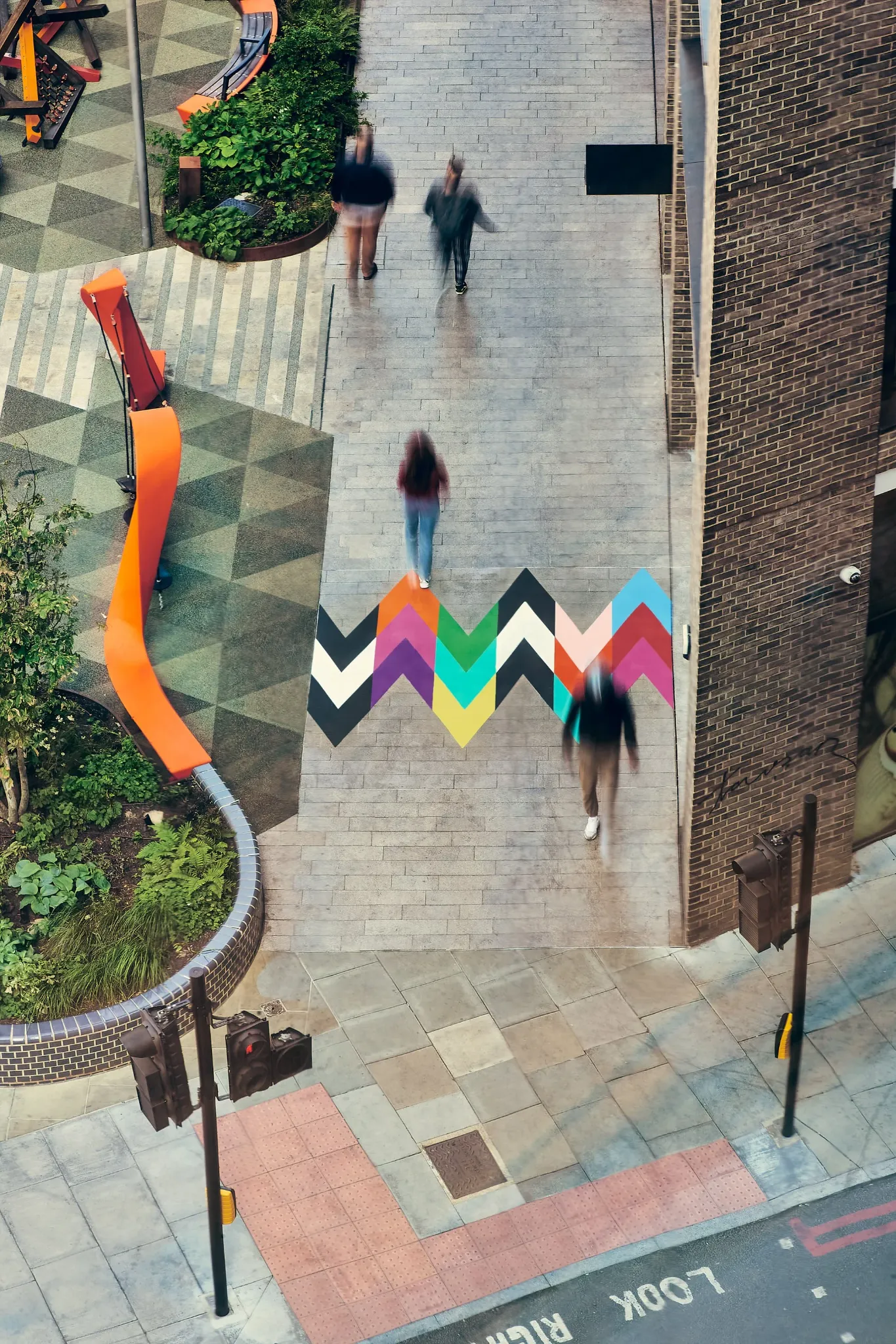 Intersection artwork connecting pedestrian routes through the public space